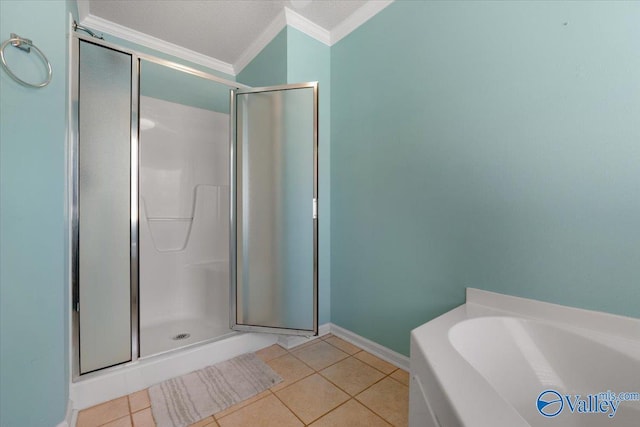 bathroom featuring ornamental molding, separate shower and tub, tile patterned flooring, and a textured ceiling