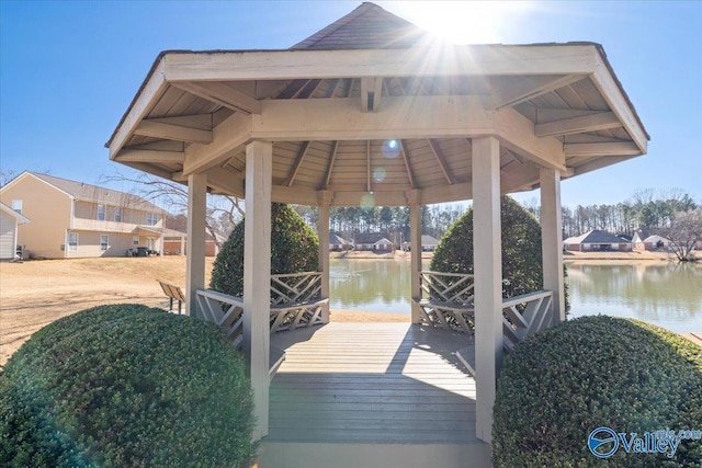 dock area with a gazebo and a water view