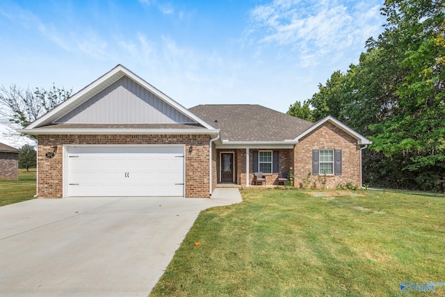 view of front of house with a garage and a front yard