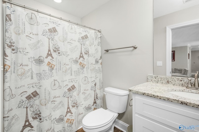 bathroom with vanity and toilet