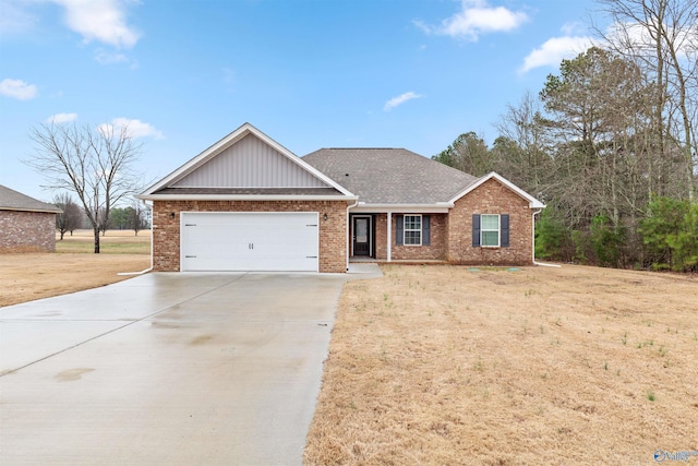 view of front of house featuring a garage and a front lawn