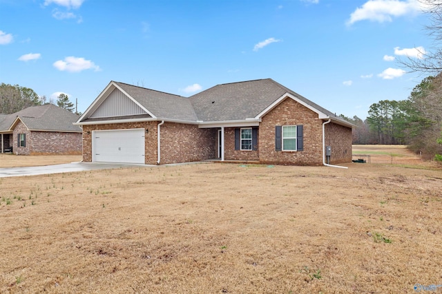 view of front of property with a garage and a front yard