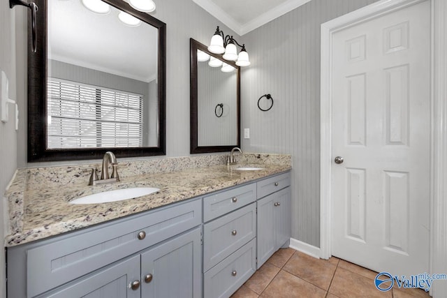 bathroom with tile patterned flooring, crown molding, and vanity