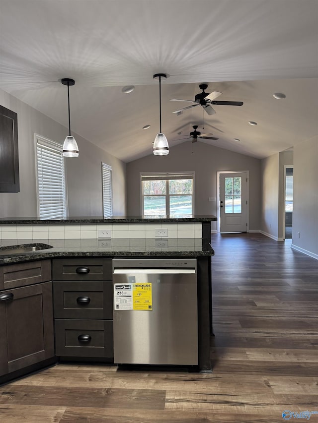 kitchen featuring dishwasher, ceiling fan, dark stone countertops, open floor plan, and dark wood-style floors