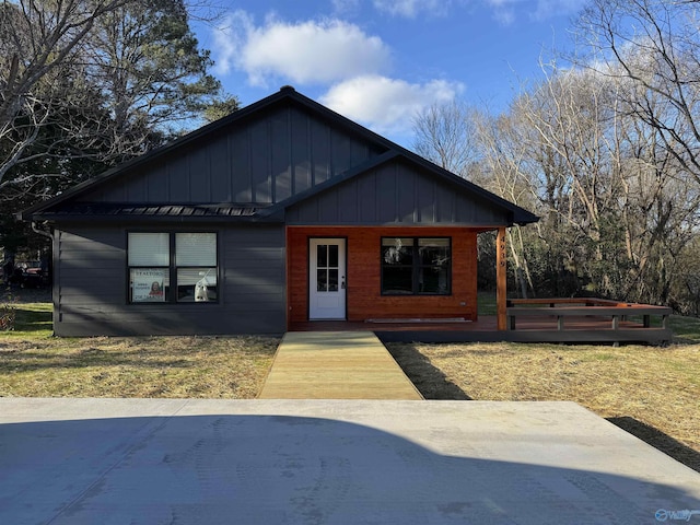 view of front of property featuring a wooden deck and board and batten siding