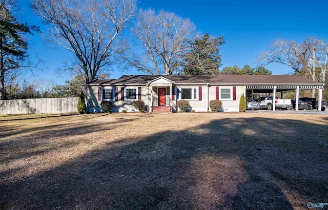 ranch-style house with a front yard and a carport