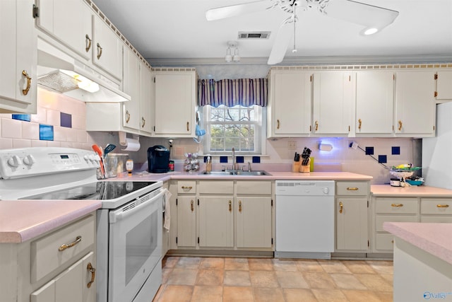 kitchen with white cabinets, decorative backsplash, white appliances, and sink