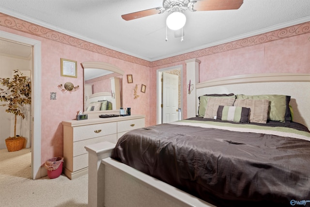 bedroom featuring carpet flooring, ceiling fan, and crown molding