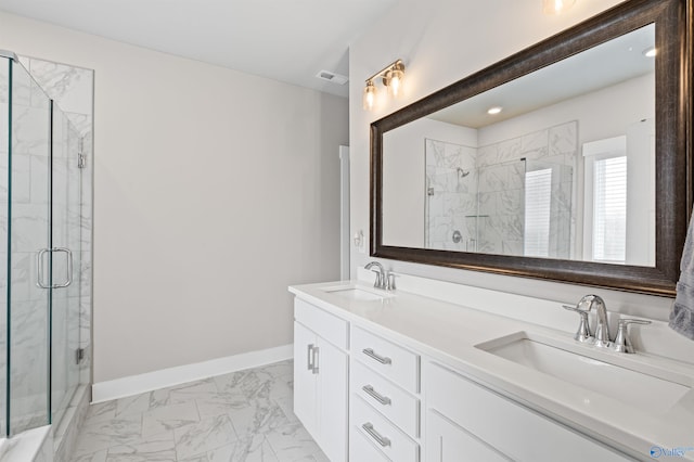 bathroom featuring an enclosed shower and vanity