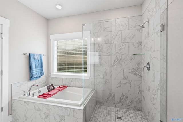 bathroom with separate shower and tub