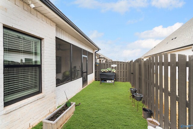 view of yard featuring a sunroom