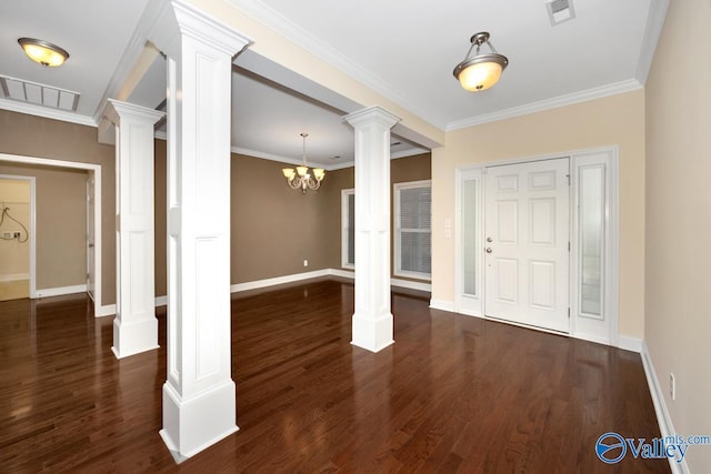 foyer entrance with visible vents, baseboards, decorative columns, a chandelier, and dark wood-style floors