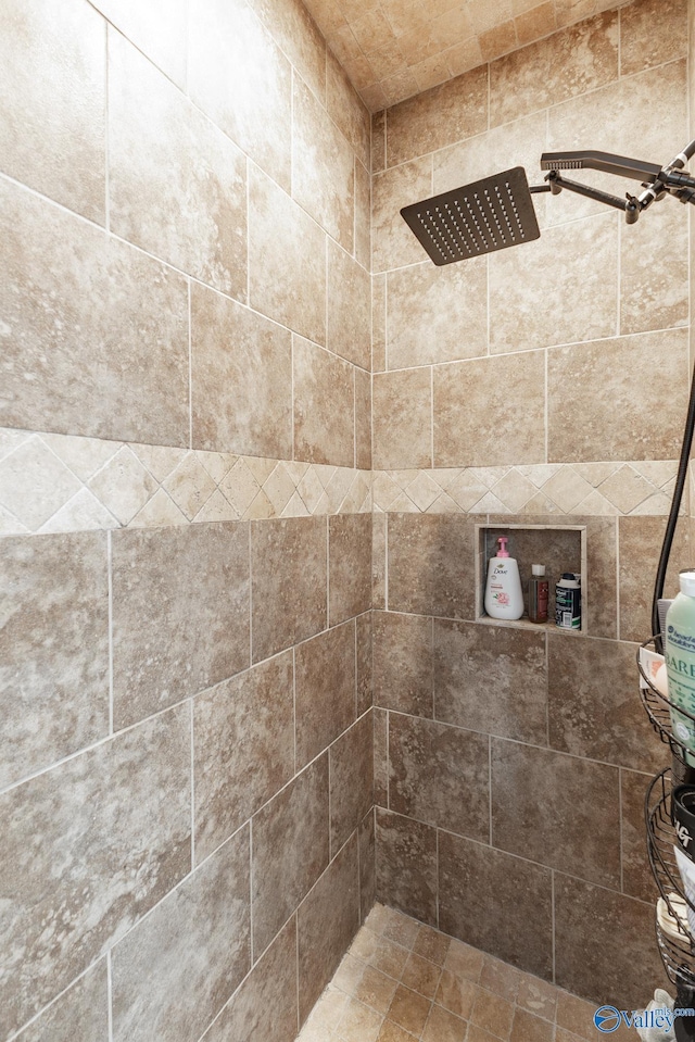 full bath featuring tiled shower