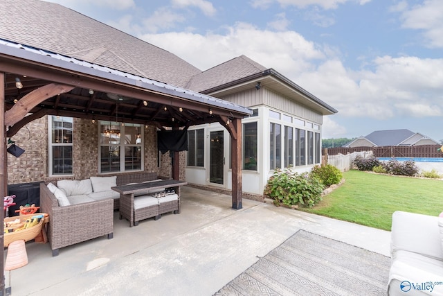 view of patio with a gazebo, an outdoor living space, fence, and a sunroom