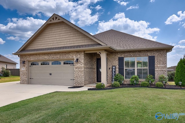 view of front facade with a garage and a front yard