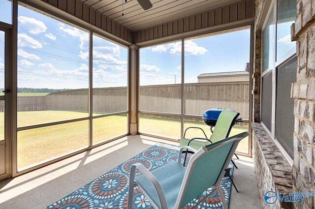 sunroom / solarium with ceiling fan and plenty of natural light