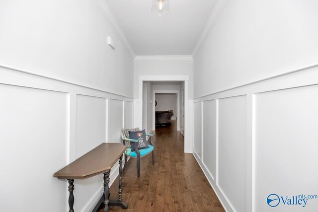 hall with crown molding and dark hardwood / wood-style floors