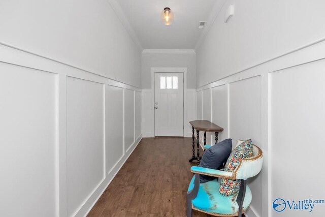 interior space with crown molding and dark hardwood / wood-style flooring