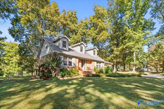 19660 Cox Rd, Athens, AL 35611 - cape cod house featuring brick siding and a front lawn