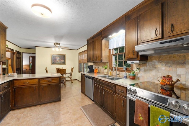 19660 Cox Rd, Athens, AL 35611 - kitchen with tasteful backsplash, a ceiling fan, under cabinet range hood, a sink, and stainless steel appliances