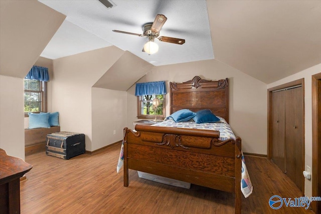 19660 Cox Rd, Athens, AL 35611 - bedroom with wood finished floors, baseboards, multiple windows, and lofted ceiling