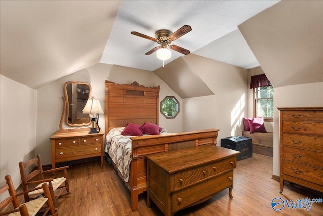 19660 Cox Rd, Athens, AL 35611 - bedroom with ceiling fan, vaulted ceiling, and wood finished floors