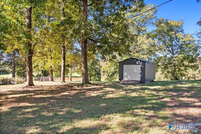 19660 Cox Rd, Athens, AL 35611 - view of yard with fence, an outbuilding, and a storage unit