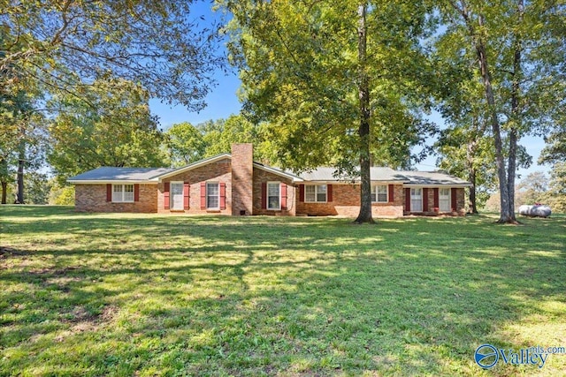 19660 Cox Rd, Athens, AL 35611 - ranch-style home with a chimney, a front lawn, and brick siding