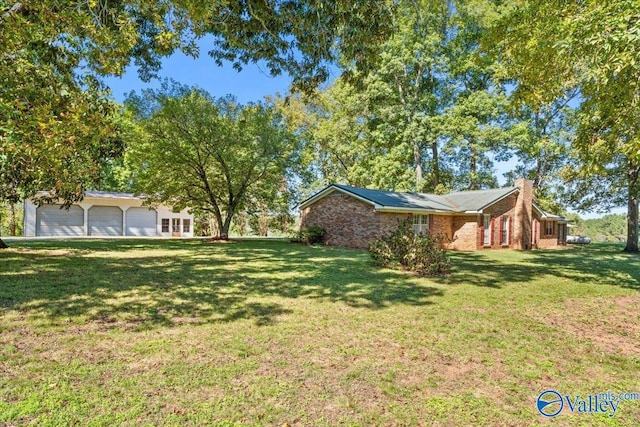 19660 Cox Rd, Athens, AL 35611 - view of yard featuring a garage