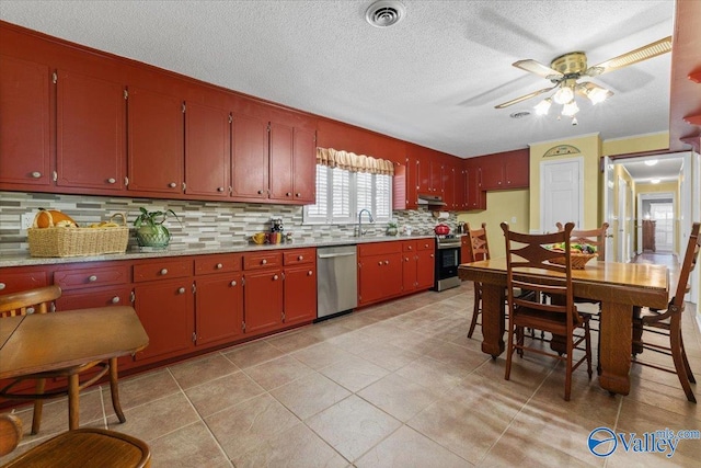 19660 Cox Rd, Athens, AL 35611 - kitchen with tasteful backsplash, visible vents, light countertops, a ceiling fan, and stainless steel appliances
