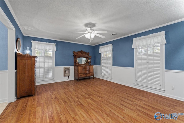 19660 Cox Rd, Athens, AL 35611 - interior space with a textured ceiling, crown molding, and a wainscoted wall