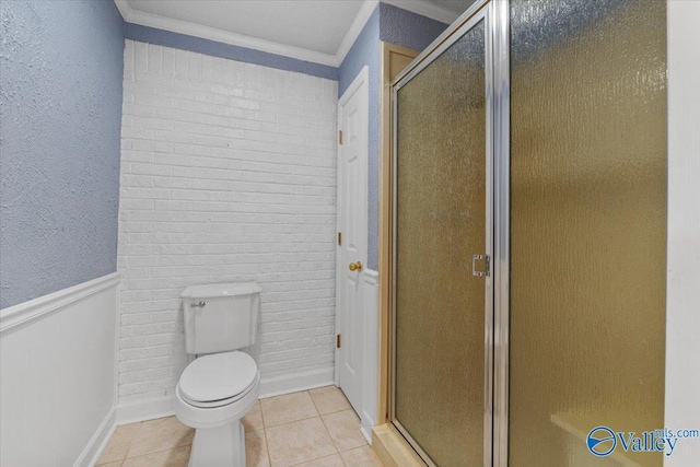 19660 Cox Rd, Athens, AL 35611 - bathroom featuring toilet, ornamental molding, tile patterned floors, and a stall shower