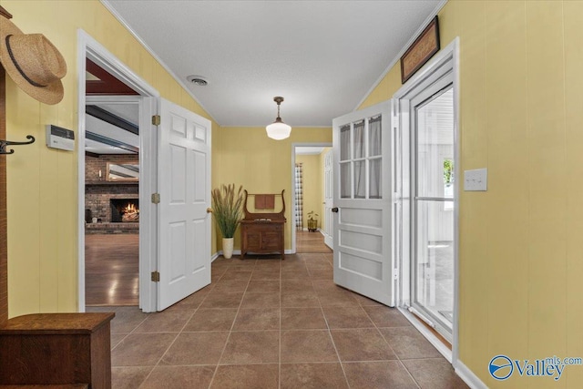 19660 Cox Rd, Athens, AL 35611 - hall featuring dark tile patterned floors, visible vents, and baseboards