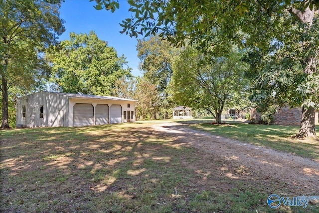 19660 Cox Rd, Athens, AL 35611 - view of yard with an outbuilding and a garage