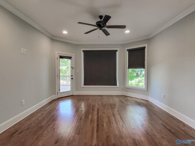 unfurnished room with ornamental molding, ceiling fan, and dark hardwood / wood-style flooring