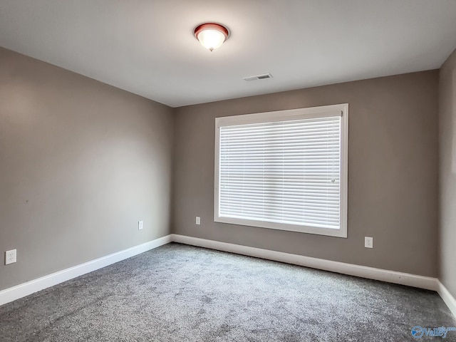 unfurnished room featuring carpet floors