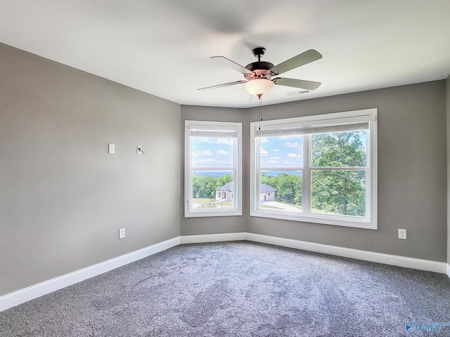 unfurnished room featuring carpet floors and ceiling fan