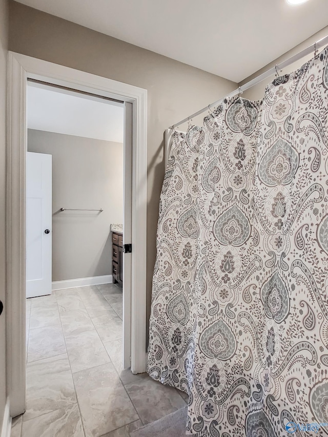 bathroom with vanity and a shower with curtain