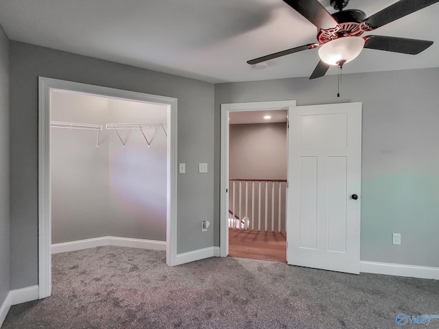 unfurnished bedroom featuring a closet, ceiling fan, and carpet