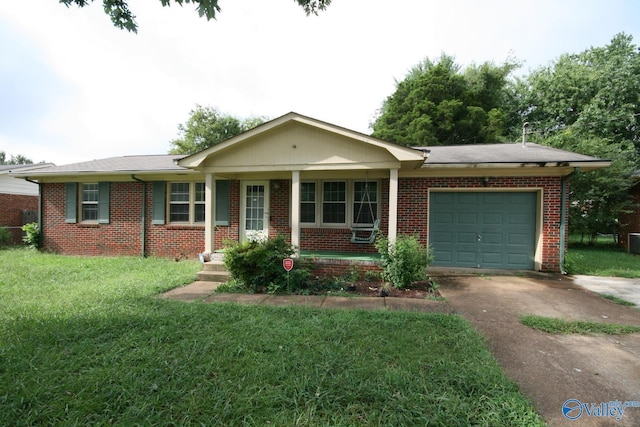 single story home featuring covered porch, a garage, and a front lawn