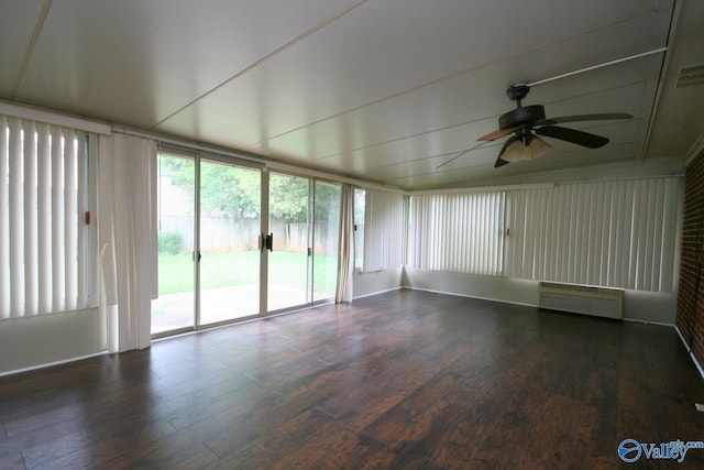 unfurnished sunroom featuring ceiling fan