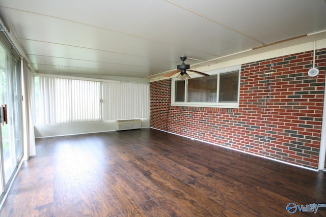 unfurnished sunroom with ceiling fan