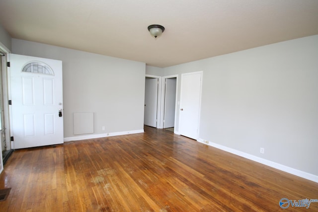 unfurnished room featuring dark hardwood / wood-style flooring