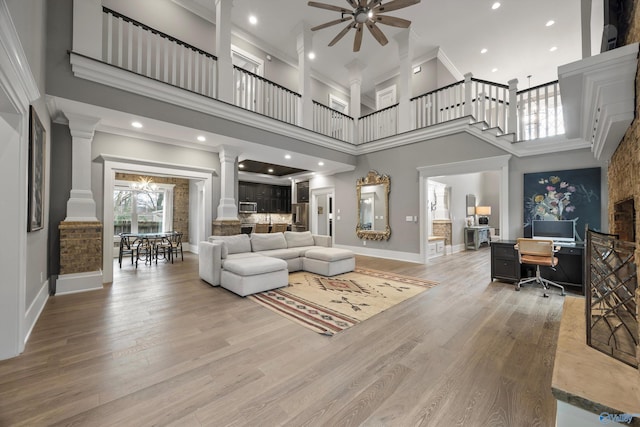 2603 Whitesburg Dr, Huntsville, AL 35801 - living room featuring ceiling fan, crown molding, and ornate columns