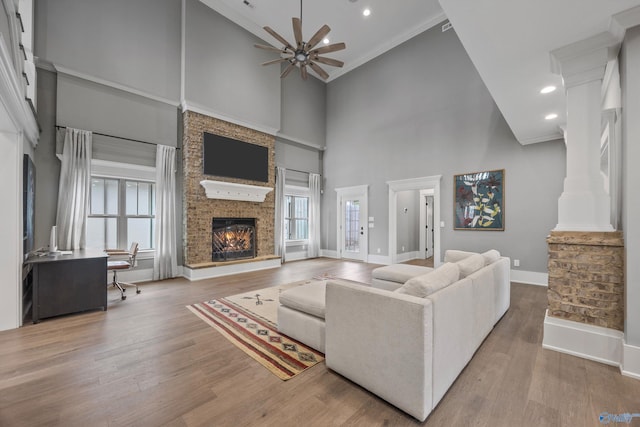2603 Whitesburg Dr, Huntsville, AL 35801 - living room with plenty of natural light, a ceiling fan, a towering ceiling, and a fireplace