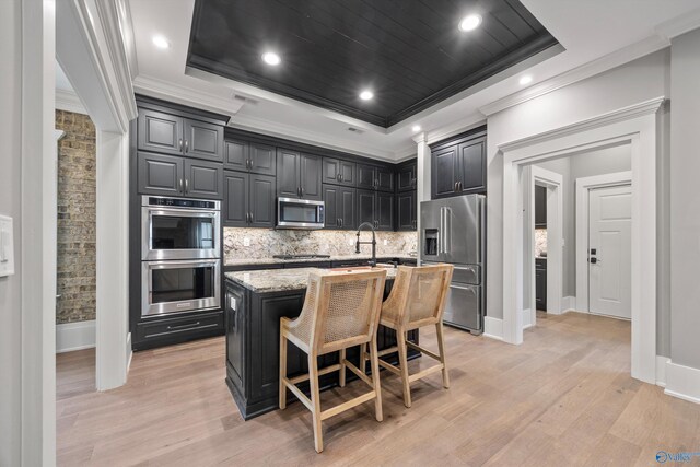 2603 Whitesburg Dr, Huntsville, AL 35801 - kitchen featuring backsplash, a raised ceiling, appliances with stainless steel finishes, and ornamental molding