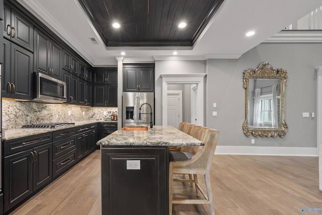 2603 Whitesburg Dr, Huntsville, AL 35801 - kitchen with appliances with stainless steel finishes, dark cabinetry, and light wood-type flooring