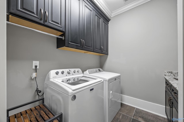 2603 Whitesburg Dr, Huntsville, AL 35801 - clothes washing area featuring baseboards, washer and dryer, ornamental molding, and cabinet space