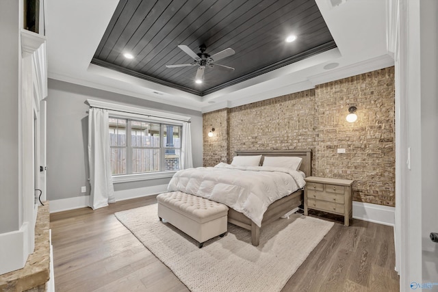 2603 Whitesburg Dr, Huntsville, AL 35801 - bedroom with baseboards, wood finished floors, ornamental molding, and a raised ceiling