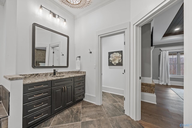 2603 Whitesburg Dr, Huntsville, AL 35801 - bathroom with vanity, crown molding, and baseboards